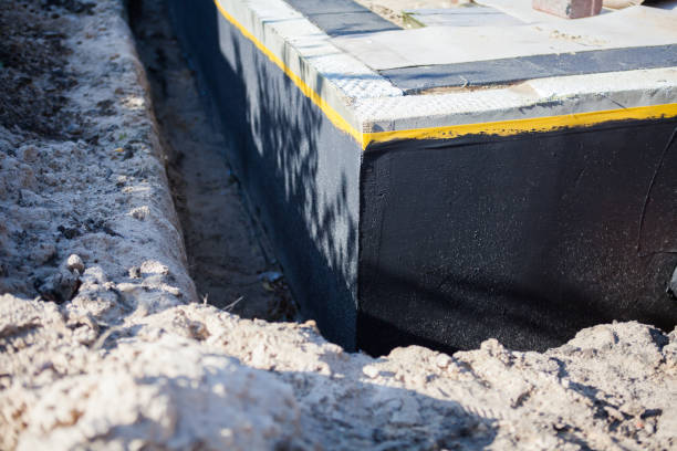 Professional Wet Basement Repair technician working in Augusta, WI